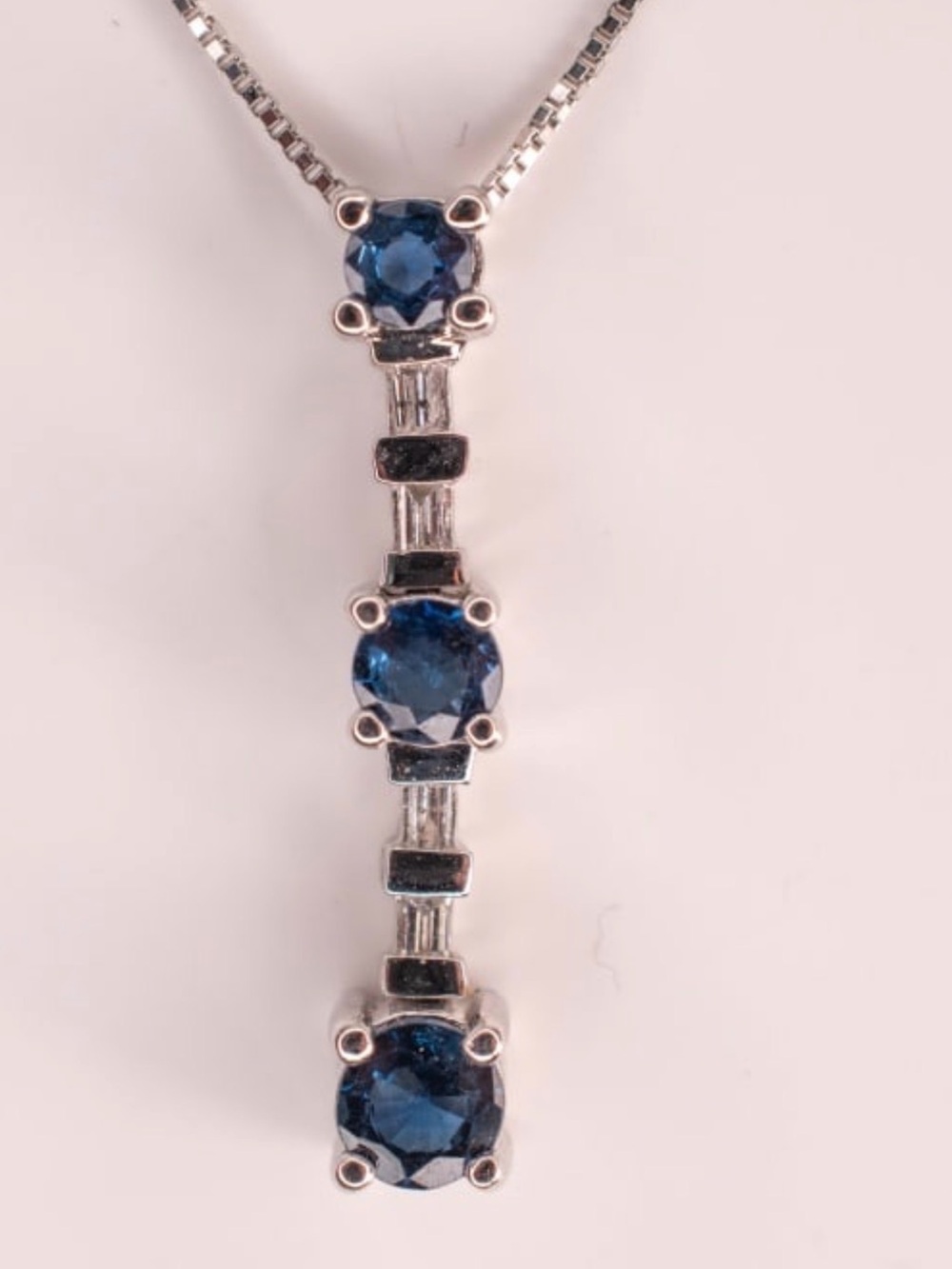 14k white gold and sapphire and diamond pendant on white gold chain.